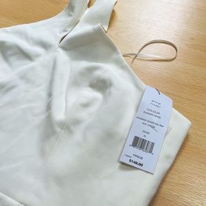 Revolve cream (off white) dress. NEVER WORN. Size 6